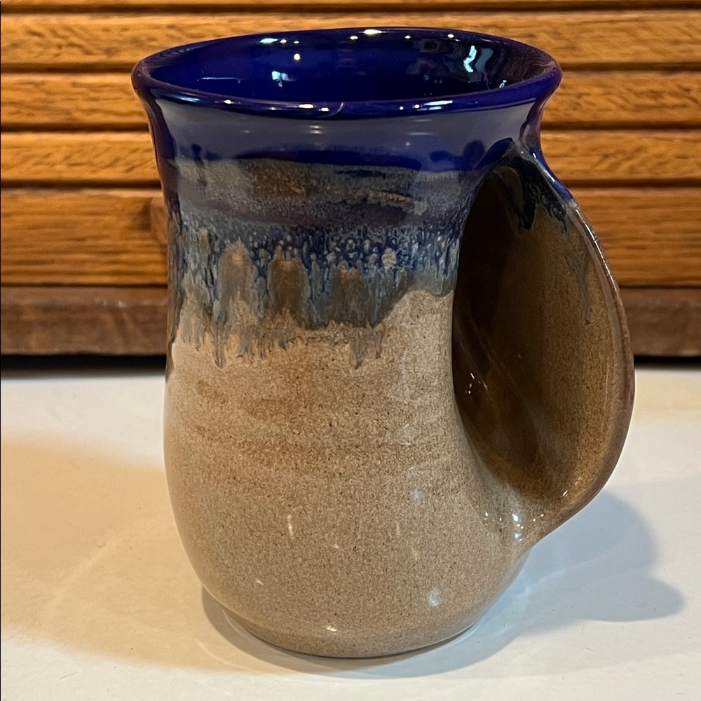 Handwarmer Mug by Clay in Motion, cobalt canyon glaze. Side pocket warms hands.